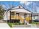 Newly renovated home with a modern farmhouse exterior and welcoming front porch at 1097 Hubbard Sw St, Atlanta, GA 30310