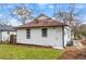 White house exterior with a brown roof and small yard at 1097 Hubbard Sw St, Atlanta, GA 30310