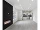 Open concept living room showcasing a modern fireplace and kitchen at 1097 Hubbard Sw St, Atlanta, GA 30310