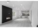 Open concept living area with modern fireplace and kitchen view at 1097 Hubbard Sw St, Atlanta, GA 30310