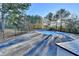 Inviting pool with surrounding trees and a hot tub at 1470 Stone Lea Dr, Oxford, GA 30054