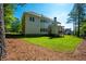 Large, grassy backyard with a two-story home featuring a deck, ideal for Gathering gatherings at 119 Terrace View Dr, Acworth, GA 30101