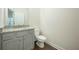 Half bathroom with granite countertop and gray vanity at 119 Terrace View Dr, Acworth, GA 30101