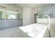 Modern Primary bathroom featuring dual vanities, a soaking tub, and marble tile floor at 119 Terrace View Dr, Acworth, GA 30101