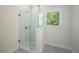Modern bathroom featuring a glass shower enclosure and tiled floor at 119 Terrace View Dr, Acworth, GA 30101