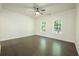 Bright bedroom with two large windows and dark wood floors at 119 Terrace View Dr, Acworth, GA 30101