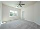 Bedroom with plush carpeting, a ceiling fan, and ample natural light at 119 Terrace View Dr, Acworth, GA 30101