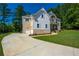 Side view of a house with mixed siding and a concrete driveway at 119 Terrace View Dr, Acworth, GA 30101