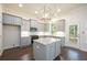 Spacious kitchen featuring gray cabinets, an island with granite countertops, and stainless steel appliances at 119 Terrace View Dr, Acworth, GA 30101