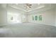 Spacious main bedroom with tray ceiling and plush carpeting at 119 Terrace View Dr, Acworth, GA 30101