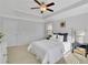 Spacious bedroom featuring white bedding, a ceiling fan, and ample natural light at 2201 Fullers Aly, Kennesaw, GA 30144