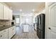 Spacious kitchen with white cabinets, granite countertops, and stainless steel appliances at 2534 Grayton Loop, Villa Rica, GA 30180