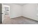 Bright bedroom featuring neutral walls and carpet at 5388 Heron Bay Blvd, Locust Grove, GA 30248