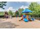 Community playground with multiple playsets and shade structure at 5388 Heron Bay Blvd, Locust Grove, GA 30248