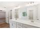 Elegant bathroom with double vanity and a large mirror at 5392 Heron Bay Blvd, Locust Grove, GA 30248