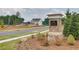 The Point at Heron Bay community entrance with landscaping and a new home visible at 5392 Heron Bay Blvd, Locust Grove, GA 30248