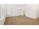 Bright dining room with hardwood floors and chandelier at 5392 Heron Bay Blvd, Locust Grove, GA 30248