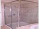 Bathroom with a large glass shower and neutral tile at 3317 Sw Regent Sw Pl, Atlanta, GA 30311