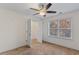 Well-lit bedroom featuring a ceiling fan and walk-in closet at 3462 Mount Zion Rd, Stockbridge, GA 30281