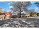 Home's exterior, featuring brick facade and a large tree, adds curb appeal at 1112 Delaware Se Ave, Atlanta, GA 30316