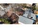 Aerial view of house, backyard, and inground pool with surrounding trees at 5023 Vernon Oaks Dr, Atlanta, GA 30338