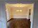 Dining Room with chandelier, chair rail, and dark wood floors, viewed from doorway at 5023 Vernon Oaks Dr, Atlanta, GA 30338