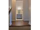 View of hallway with wood-look flooring and open door to the bathroom at 5023 Vernon Oaks Dr, Atlanta, GA 30338