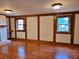 Spacious living room with wood floors, white brick fireplace, and large windows at 5023 Vernon Oaks Dr, Atlanta, GA 30338