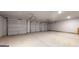 Spacious three-car garage with high ceilings at 311 Bianca Way, Mcdonough, GA 30253