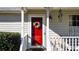 Welcoming front porch with a bright red door and decorative wreath at 14 Glenmore Dr, Kingston, GA 30145