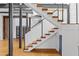 Modern staircase with wood steps and cable railing at 142 Walker Sw St, Atlanta, GA 30313