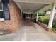 Covered front porch with brick flooring and supports at 2385 Perkerson Sw Rd, Atlanta, GA 30315