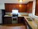 Kitchen with granite countertops and wood cabinets at 2385 Perkerson Sw Rd, Atlanta, GA 30315