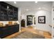 Butler's pantry with dark cabinetry, glass-front doors, and marble countertop at 542 Orme Ne Cir, Atlanta, GA 30306