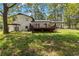 Spacious backyard with deck and wooded area at 67 Heron Dr, Riverdale, GA 30274