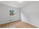 Empty bedroom with neutral walls, wood-look floors, and a single window at 67 Heron Dr, Riverdale, GA 30274