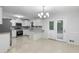 Modern kitchen with white cabinets, stainless steel appliances, and tile floor at 67 Heron Dr, Riverdale, GA 30274