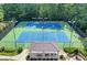 Two well-maintained tennis courts with a covered seating area at 8647 Ellard Dr, Alpharetta, GA 30022