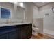 Modern bathroom with dark wood vanity, granite countertops, and subway tile shower at 4230 Moore Rd, Conley, GA 30288
