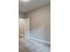 Simple bedroom with neutral walls, carpeting, and white trim at 4230 Moore Rd, Conley, GA 30288