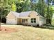 Charming new construction home with a spacious front yard at 4230 Moore Rd, Conley, GA 30288