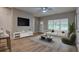 Living room with wood floors and plenty of natural light at 4230 Moore Rd, Conley, GA 30288