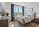 Cozy bedroom with a double bed and large windows at 127 Stein Steel St # 12, Atlanta, GA 30316