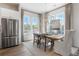 Bright dining area with large windows and a farmhouse table at 127 Stein Steel St # 12, Atlanta, GA 30316