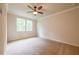 Bedroom with carpet, ceiling fan, and two windows at 138 Henley St, Canton, GA 30114