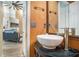 View of a bathroom sink with a modern faucet and a view of the living room at 2291 Wilkins Ct, Decatur, GA 30035