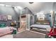 Bedroom with two beds, gray walls, and a view of a loft area at 2291 Wilkins Ct, Decatur, GA 30035
