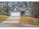 Charming two-story home with a one-car garage and landscaped yard at 2291 Wilkins Ct, Decatur, GA 30035