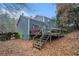 Backyard view of two-story home with deck at 2291 Wilkins Ct, Decatur, GA 30035
