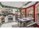 Eat-in kitchen with stainless steel appliances, white cabinets, and marble table at 2291 Wilkins Ct, Decatur, GA 30035